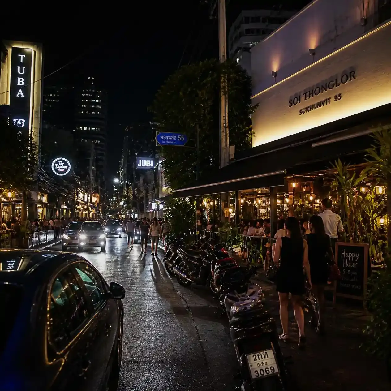Illuminated bars and restaurant frontages along Soi Thong Lo, Sukhumvit 55, in Bangkok after dark
