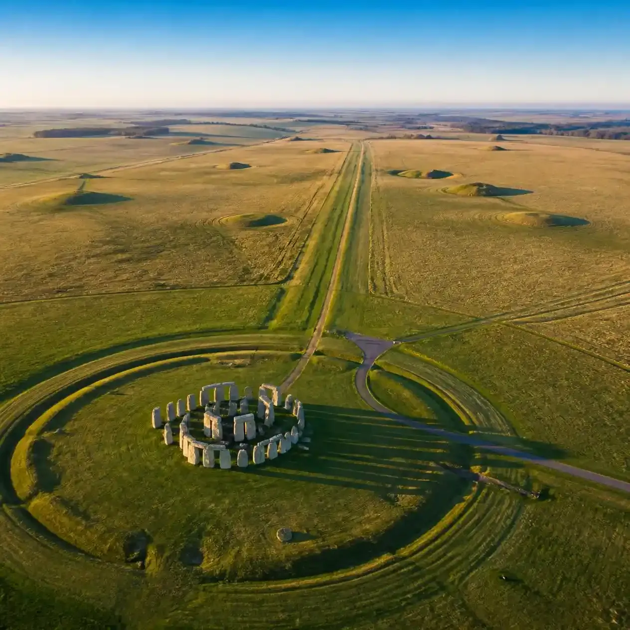 Aerial view of Stonehenge with its circular earthwork, the Avenue and prehistoric burial mounds across Salisbury Plain