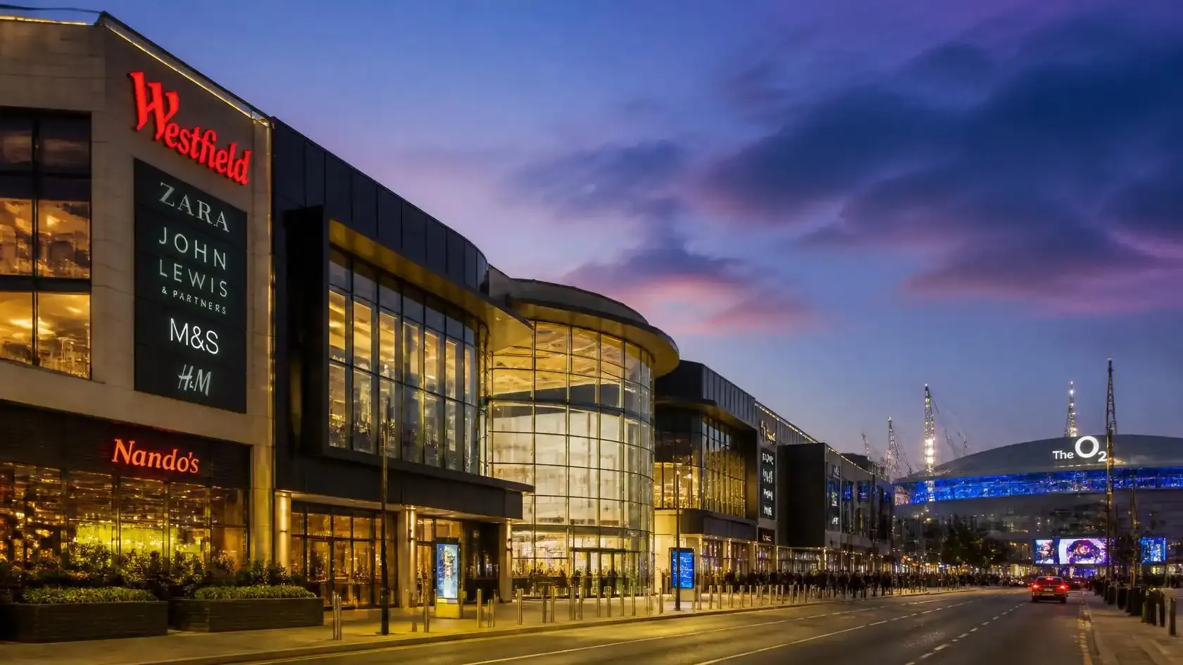 Westfield Stratford City shopping centre lit up in the evening, a short walk from ABBA Arena in east London