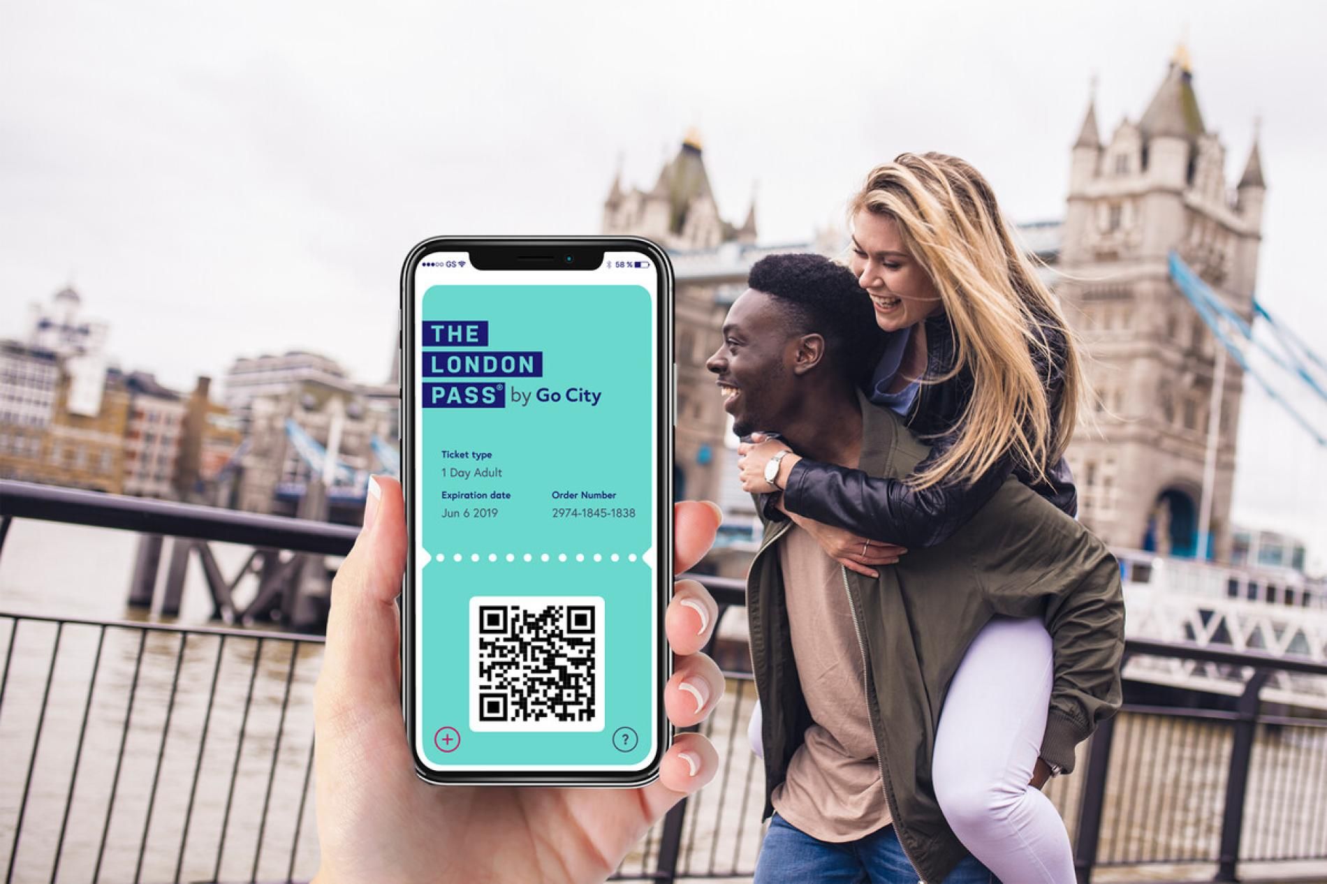 A London sightseeing pass displayed on a smartphone at the entrance to the Tower of London
