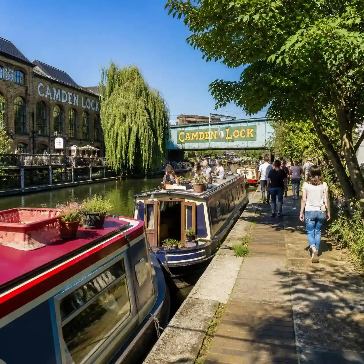 Narrowboats moored along the Regent's Canal towpath near Camden Lock in London