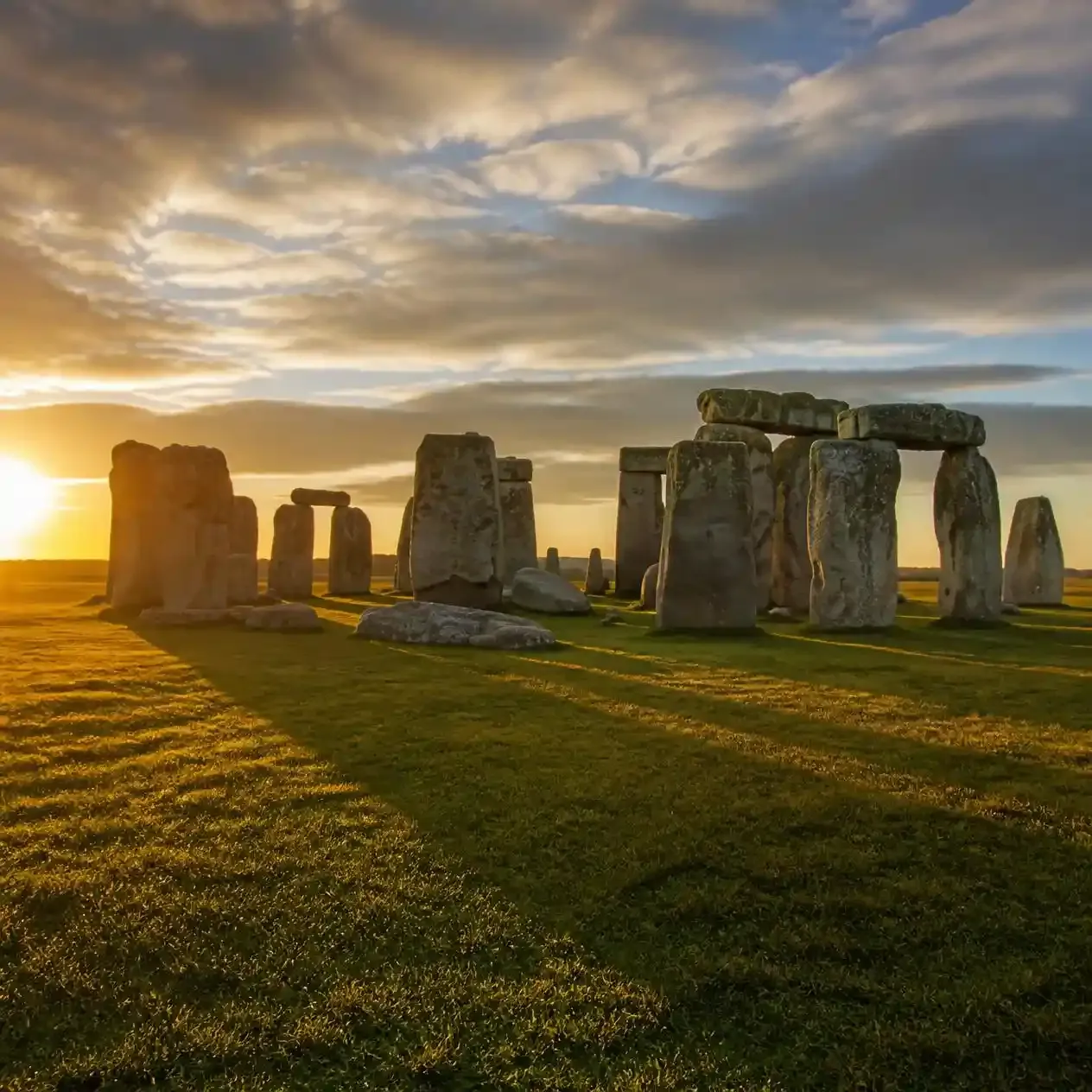 Stonehenge stone circle glowing at golden hour on Salisbury Plain in Wiltshire, England