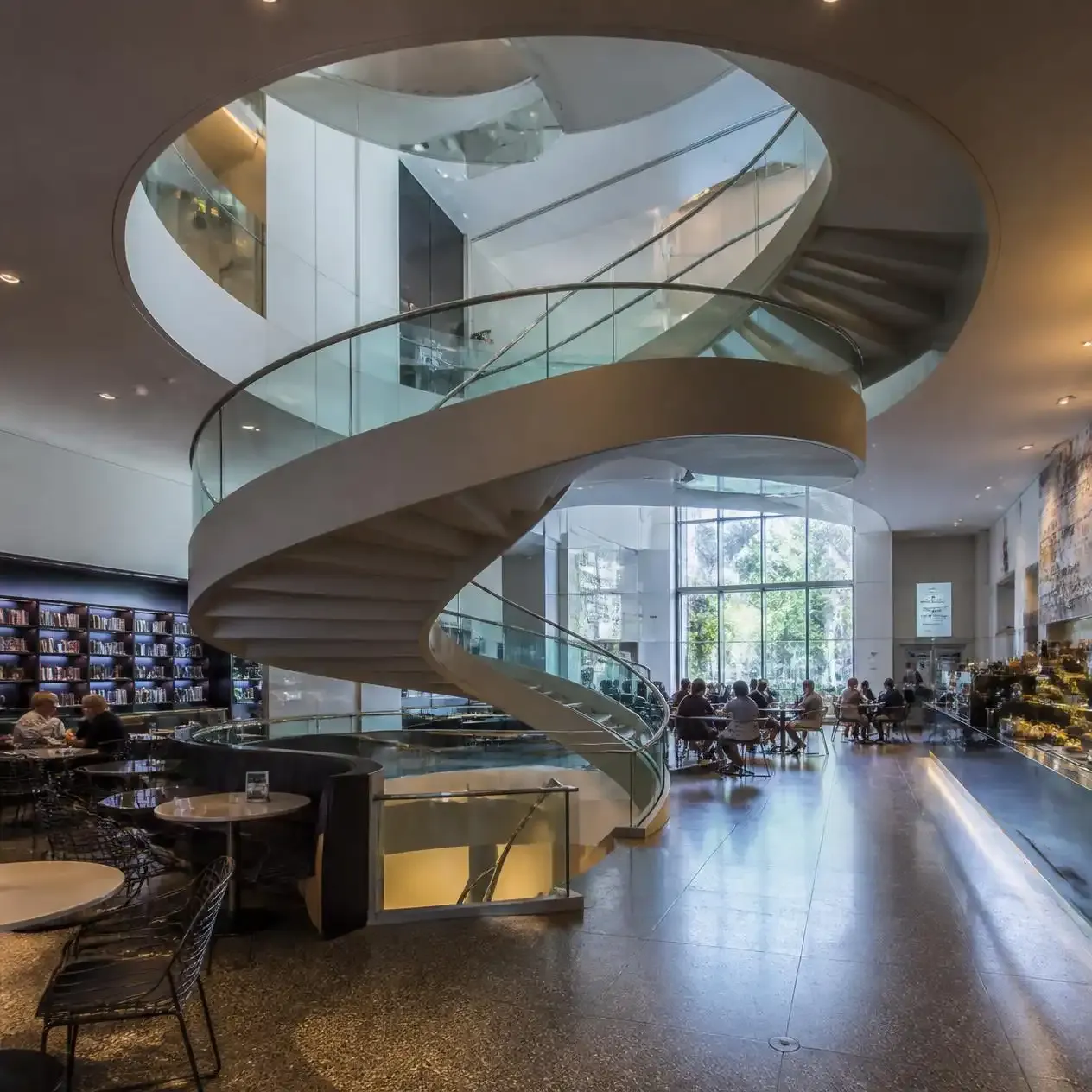 The spiral staircase and light-filled atrium above the ground-floor cafe at the Wellcome Collection London