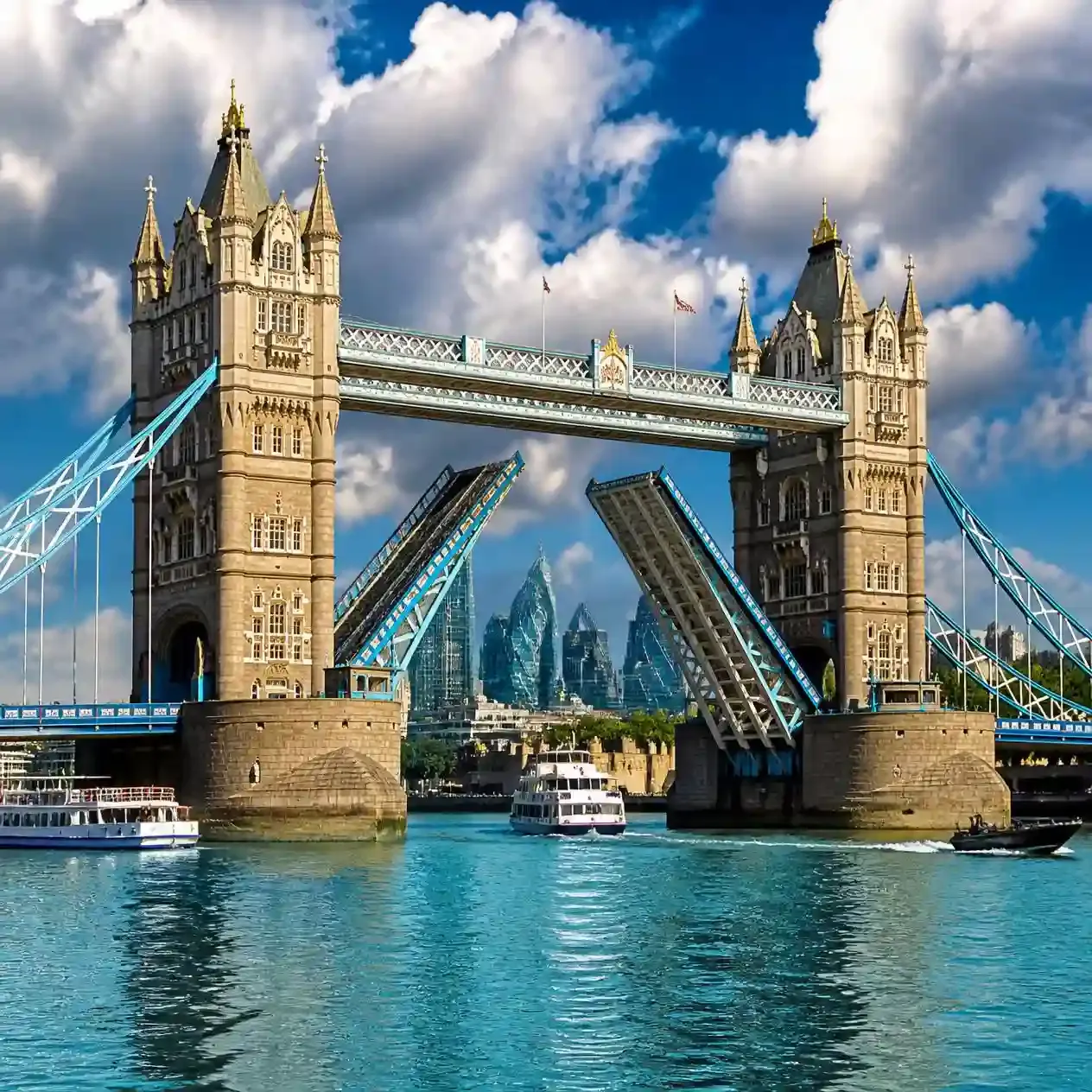 Tower Bridge bascules raised for a scheduled Bridge Lift over the River Thames, viewed from the riverside in London