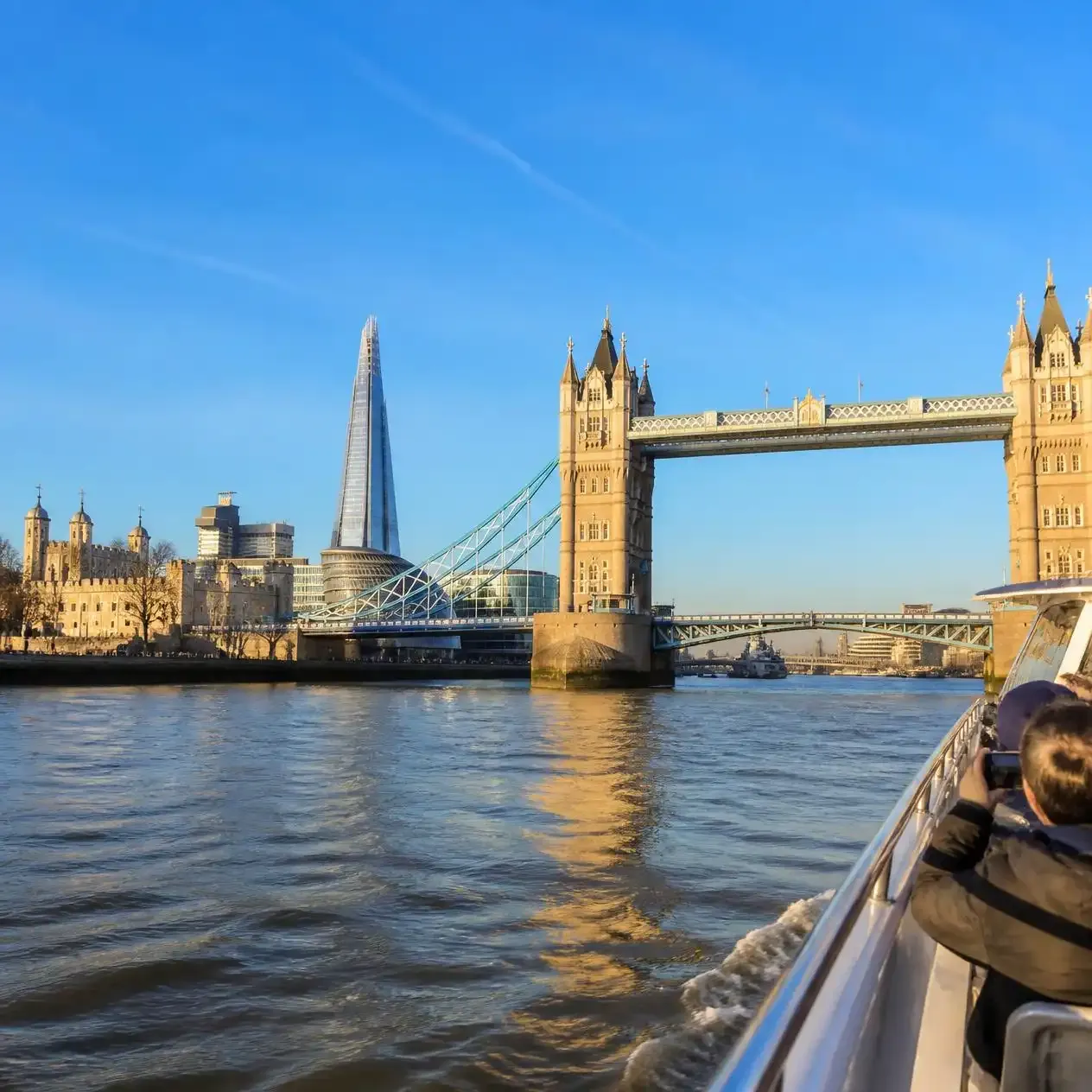 Tower Bridge and the Tower of London seen from the water on the Westminster to Greenwich cruise in London
