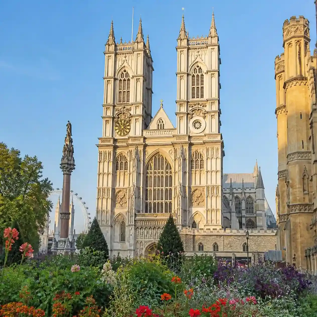 The Gothic western towers of Westminster Abbey rising above Broad Sanctuary in London morning light