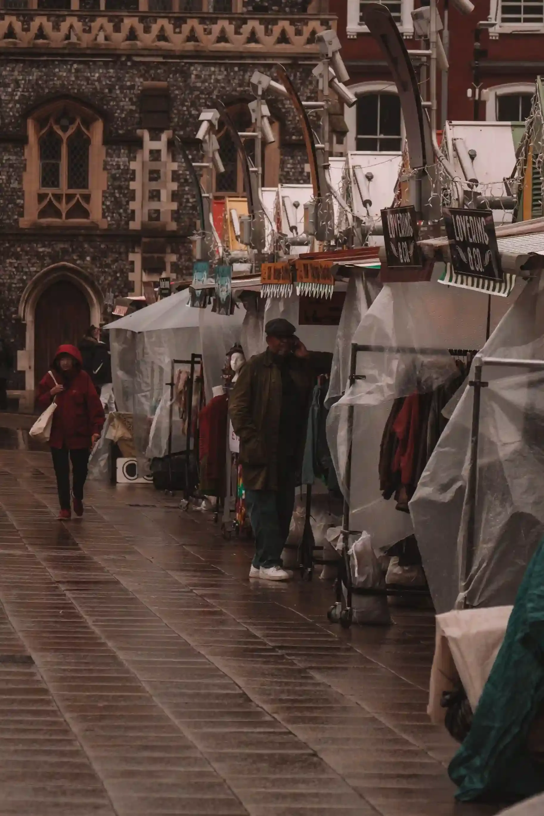 Market stalls beneath the gilded Market House in the Ancient Market Place in the centre of Kingston upon Thames