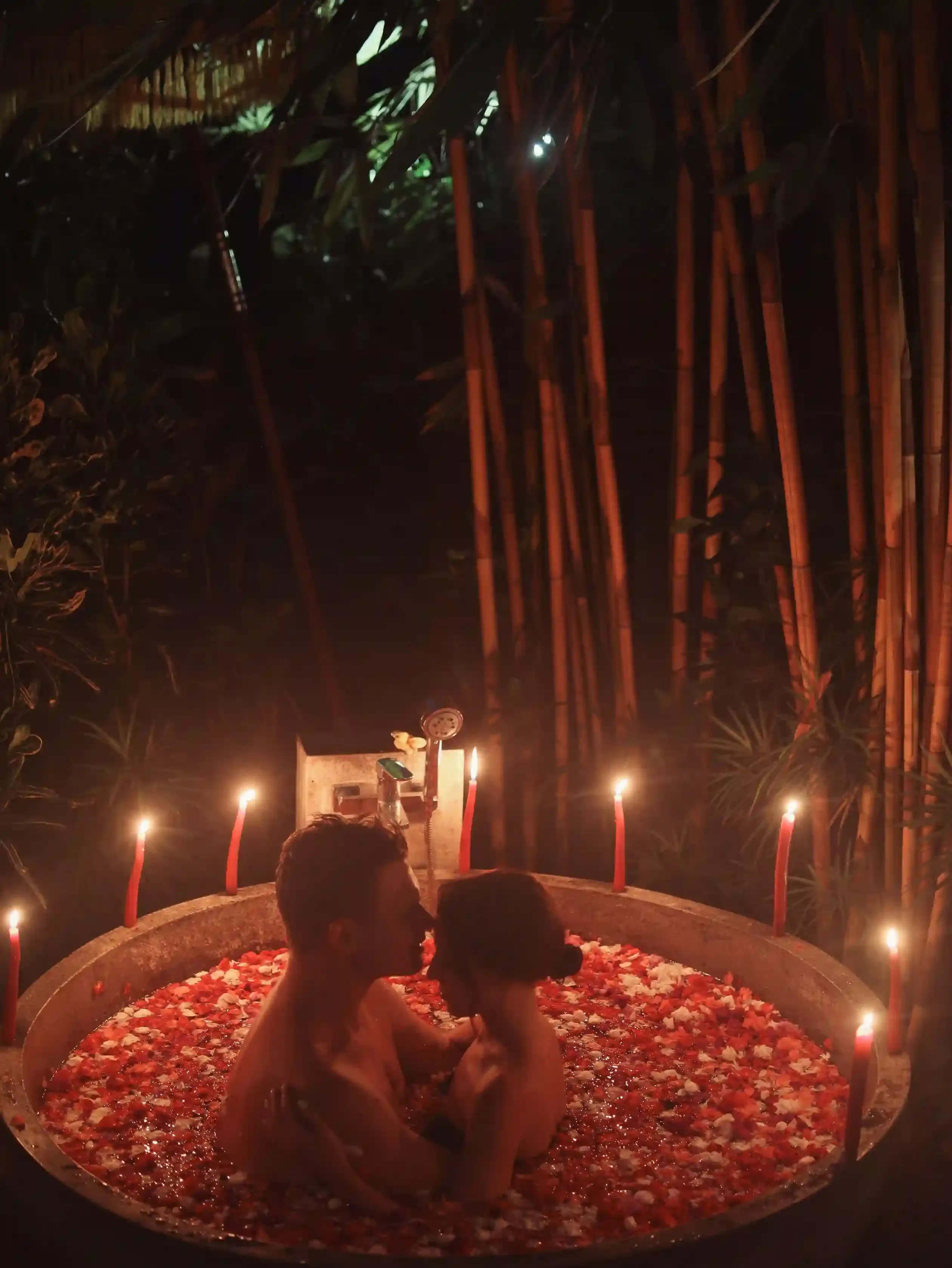 Couple relaxing together in a candlelit thermal bath at Aire Ancient Baths, a spa-for-two romantic experience in London