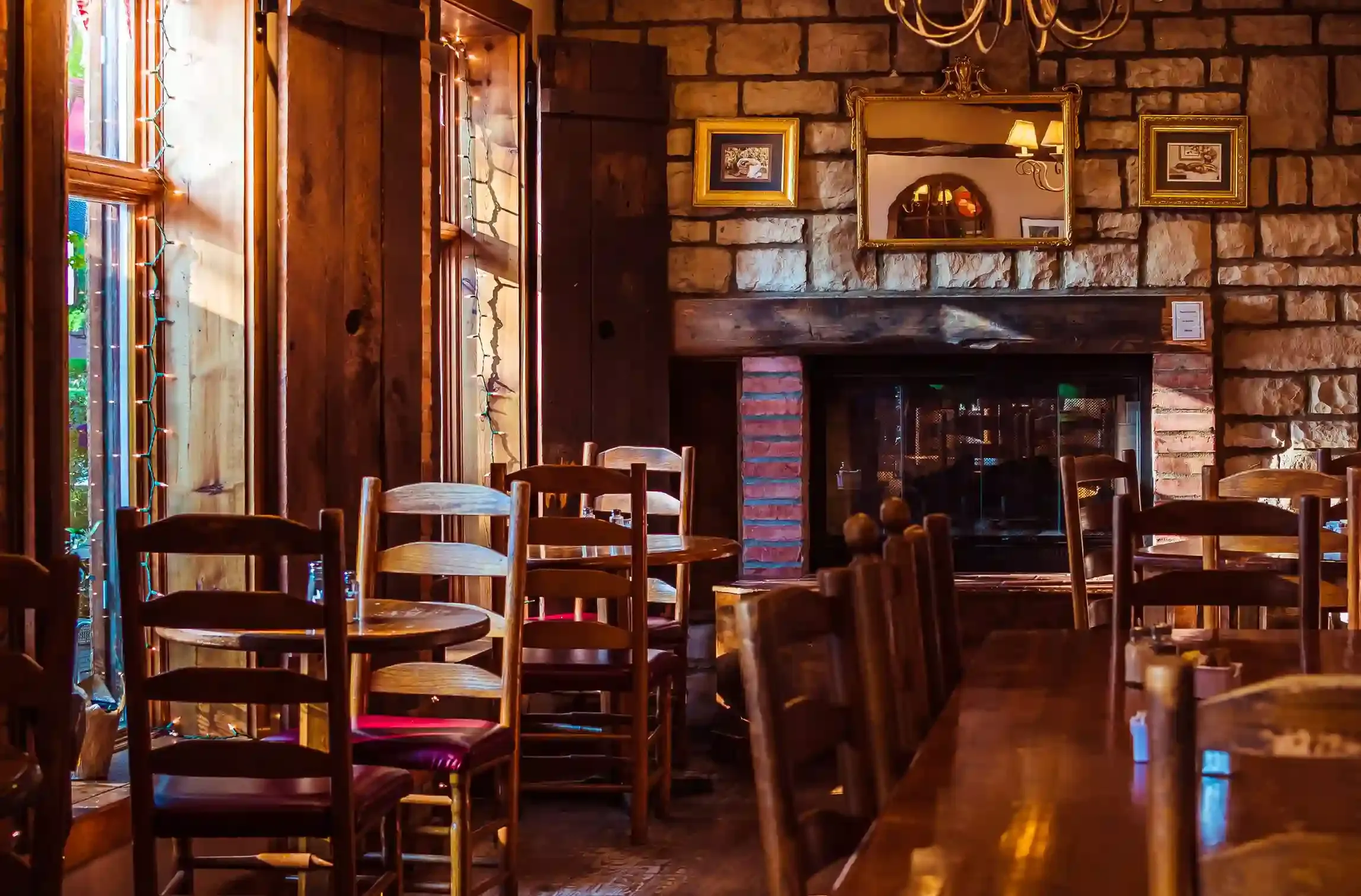 Wood-panelled bar and fireplace inside a historic Fleet Street tavern in London