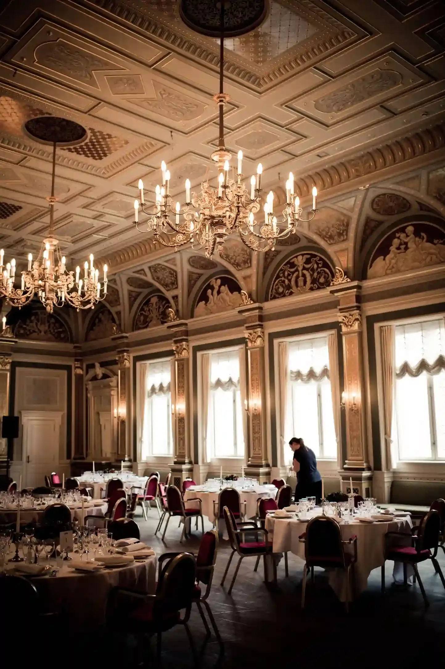 Warmly lit art-deco grand-hotel dining room in Mayfair, London, set for a special-occasion dinner