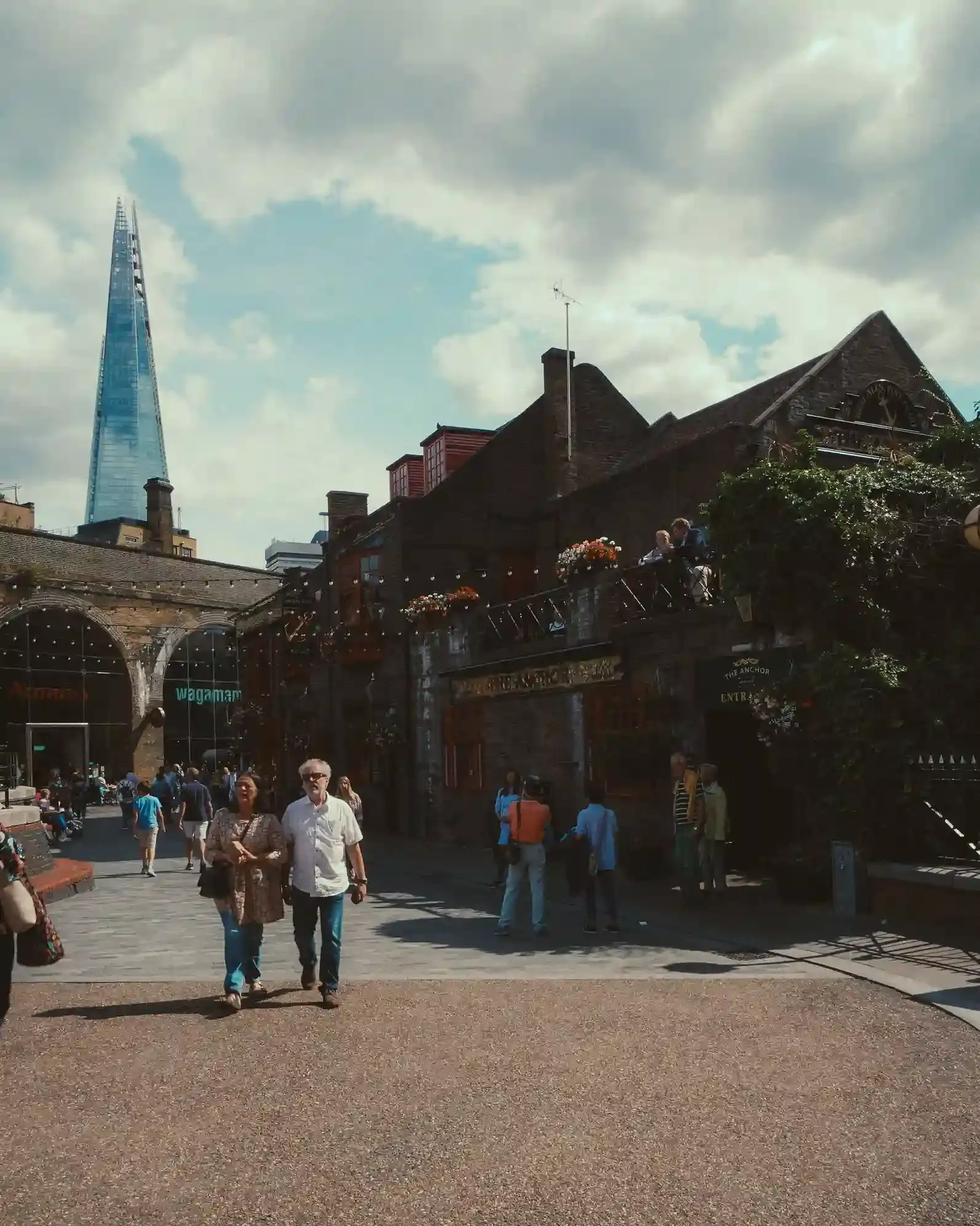 The Stoney Street entrance to Borough Market with the Shard skyscraper rising behind it in Southwark, London