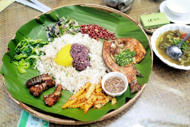 Goan fish curry, rice and xacuti served on areca-leaf plates during a spice plantation in Goa lunch