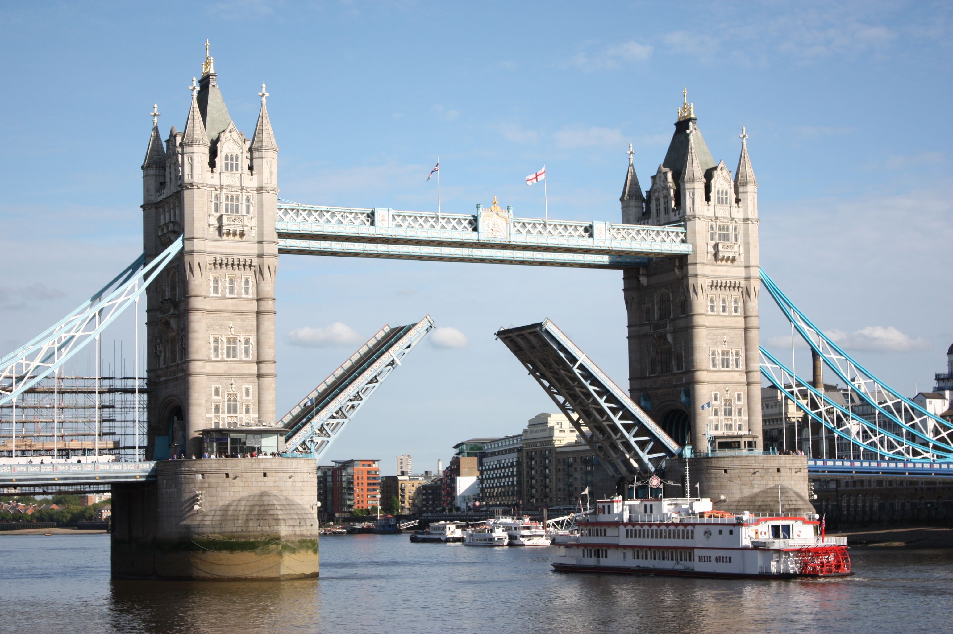 Tower Bridge seen from the deck of a London river cruise on the Thames at dusk