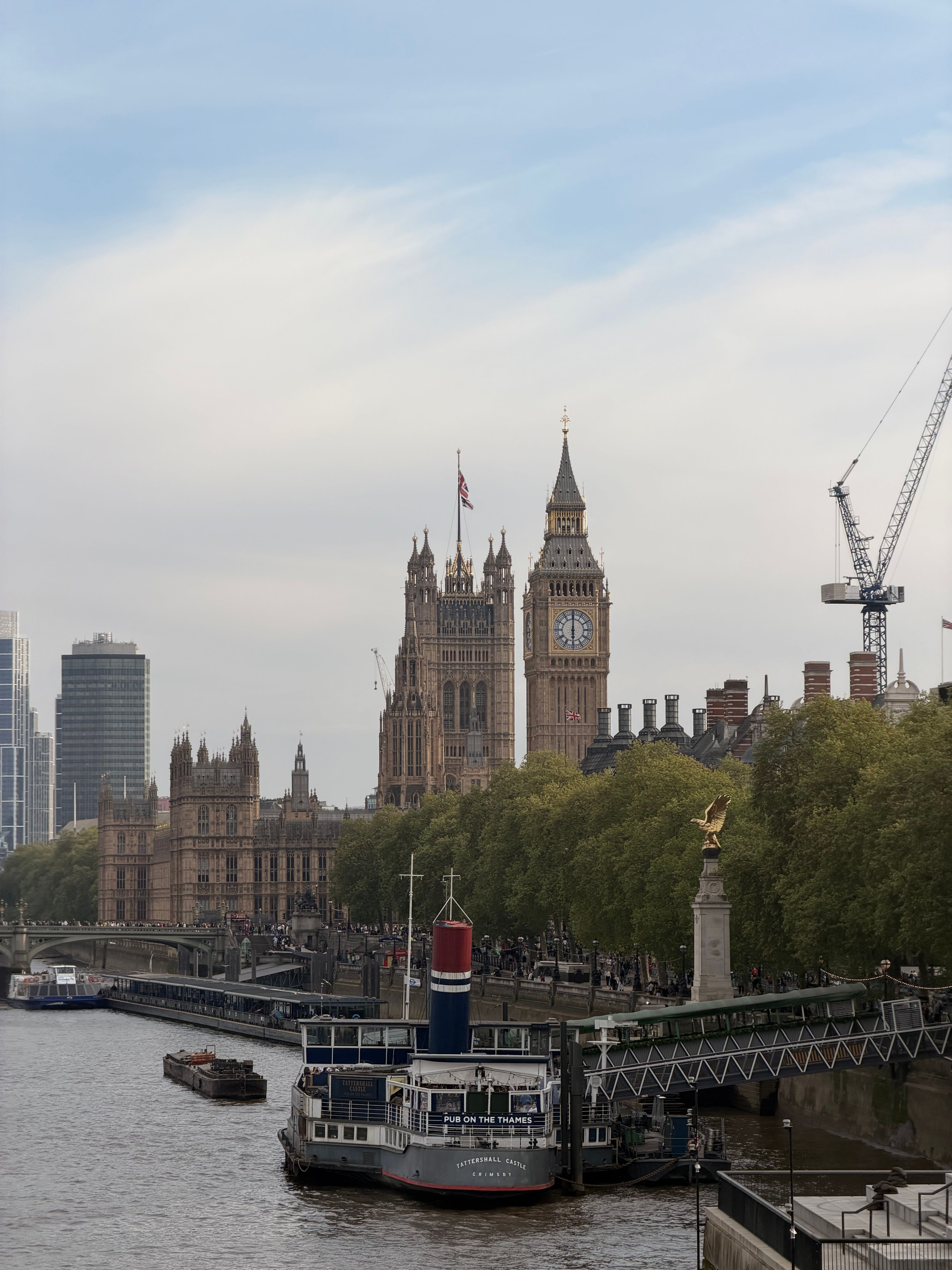 Aerial view from the top of the London Eye over the Thames toward Big Ben and Westminster in London