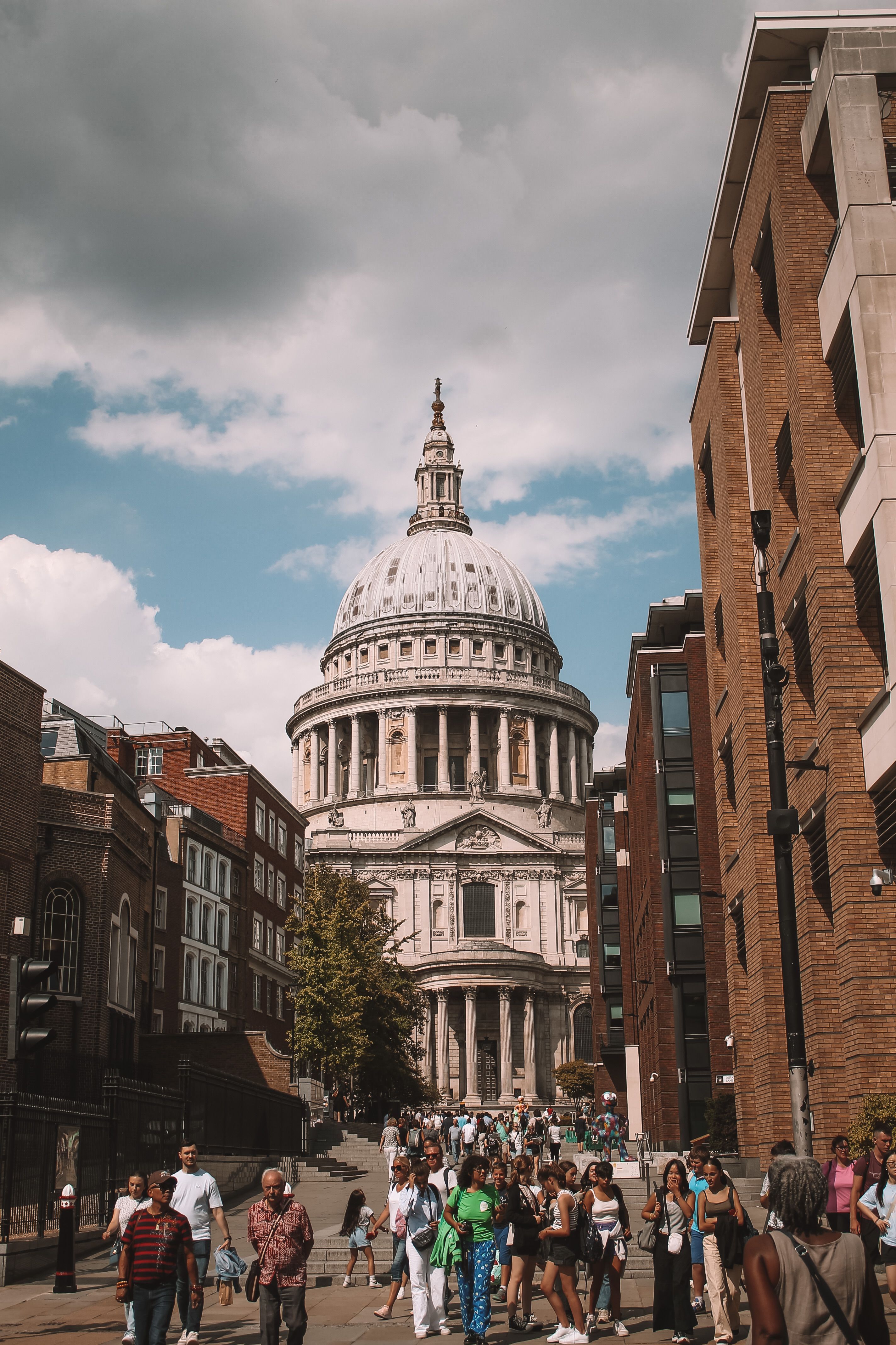 A small-group walking tour gathered in front of St Paul's Cathedral during a London sightseeing day
