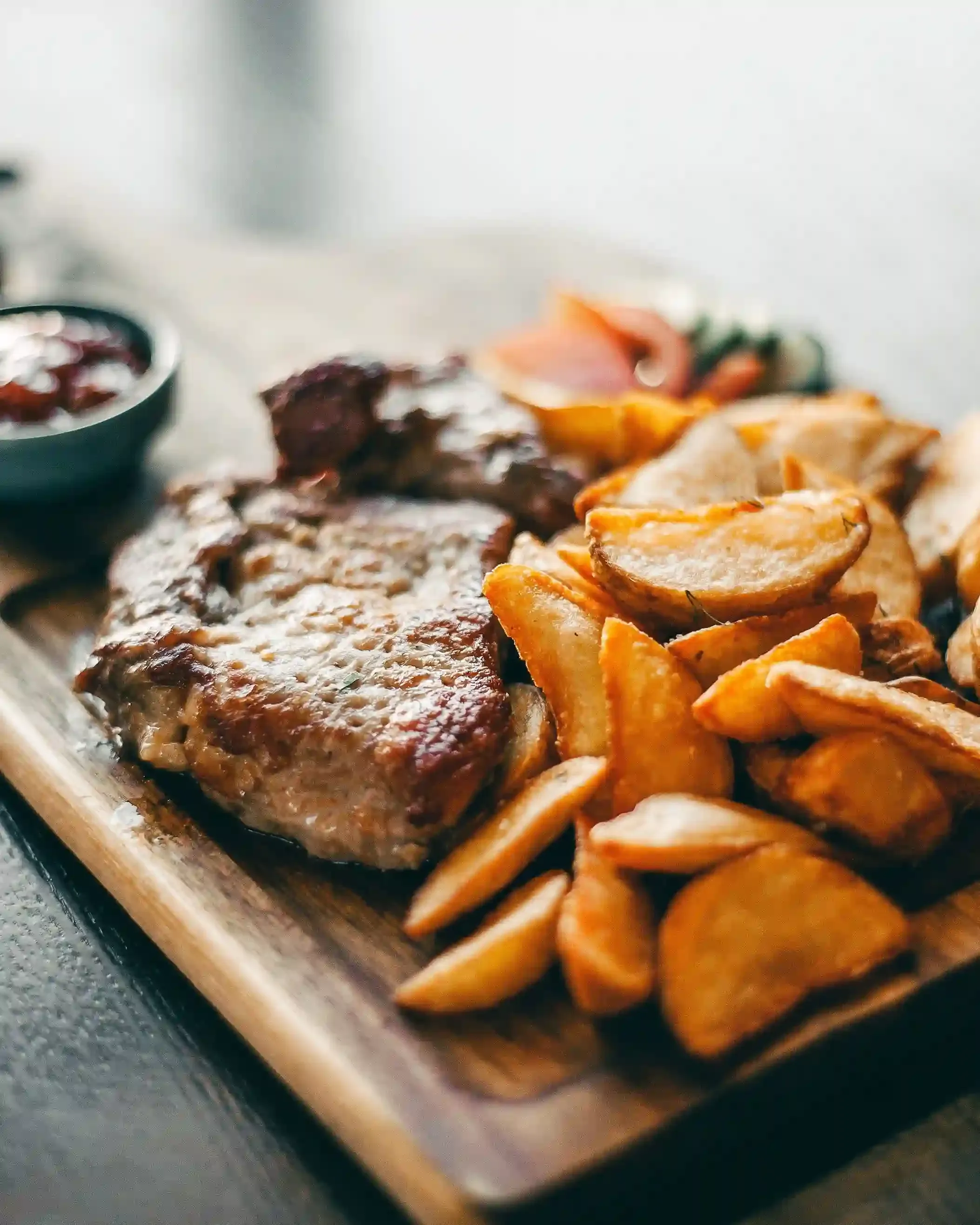 Traditional London Sunday roast with roast beef, Yorkshire pudding, roast potatoes and gravy served at a gastropub